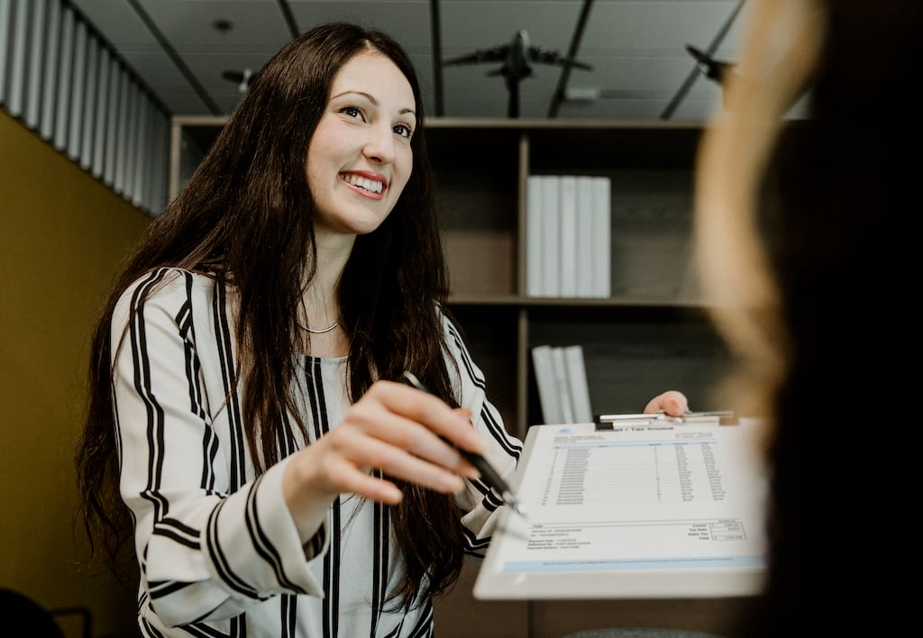 woman meeting with tax professional while doing year-end tax planning